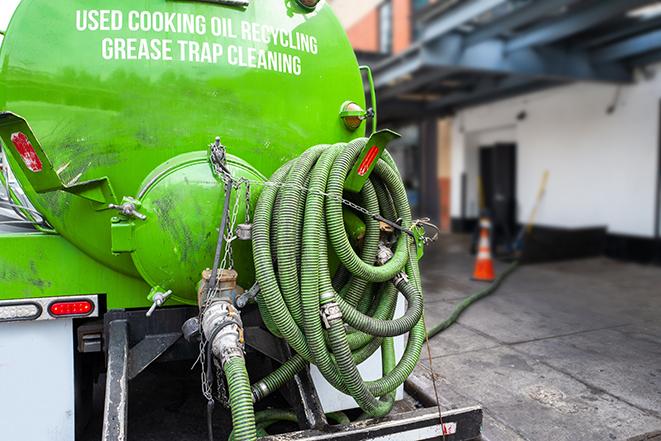 a large industrial grease trap being pumped out in Bloomington, CA